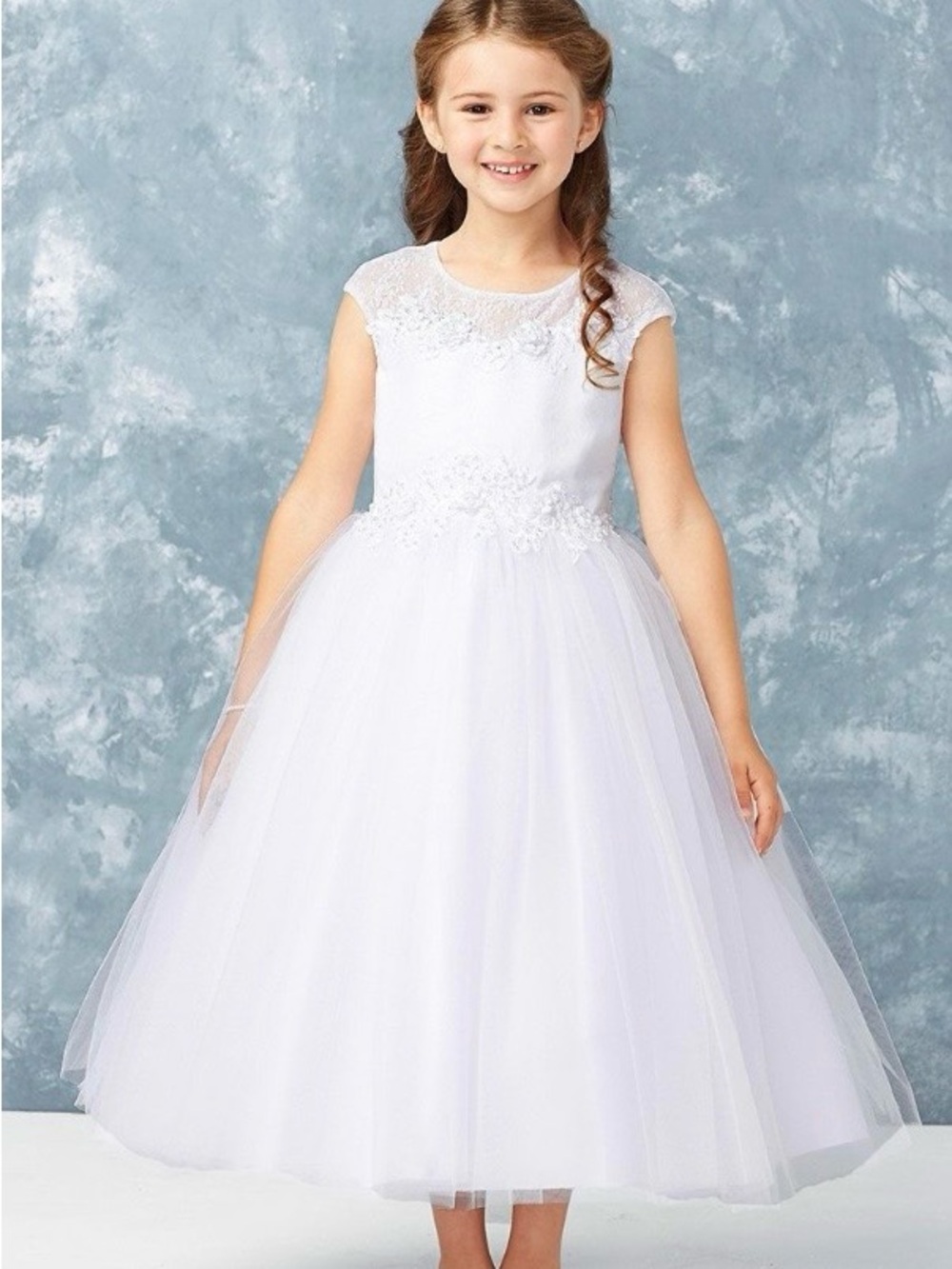 Tip Top Kids white formal dress with elegant detailing. Lace overlay bodice.